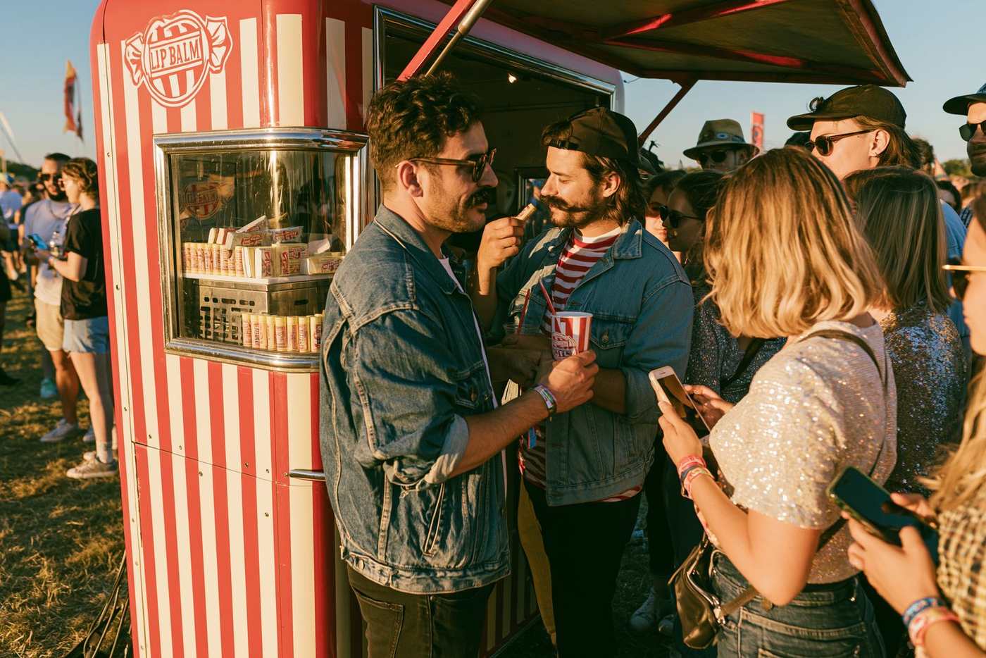 The candy-stripe stand at a modern festival